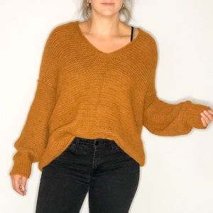 FREE PEOPLE SHRUG SWEATER IN RUST